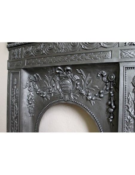 Antique cast iron mantelpiece from Paris. This Art Nouveau style fire surround dates back to the XXth century.