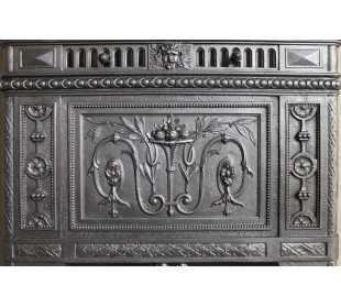 Antique “Larcher” cast iron mantelpiece with floral decorations. A refined, elegant, 19th-century antique fire surround. 2