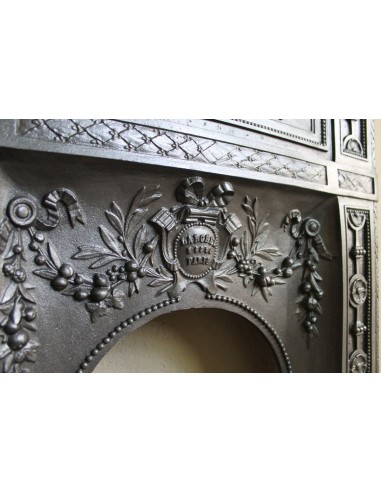 Antique “Larcher” cast iron mantelpiece with floral decorations. A refined, elegant, 19th-century antique fire surround.