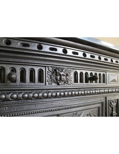 Antique “Larcher” cast iron mantelpiece with floral decorations. A refined, elegant, 19th-century antique fire surround.