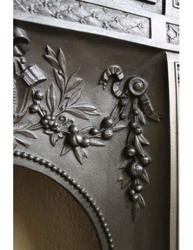Antique “Larcher” cast iron mantelpiece with floral decorations. A refined, elegant, 19th-century antique fire surround.