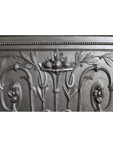 Antique “Larcher” cast iron mantelpiece with floral decorations. A refined, elegant, 19th-century antique fire surround.