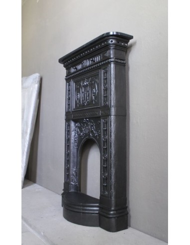 Antique “Larcher” cast iron mantelpiece with floral decorations. A refined, elegant, 19th-century antique fire surround.