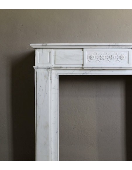 Antique neoclassical "Macaron" mantelpiece carved in Statuary Carrara marble, with exquisite architectural design.