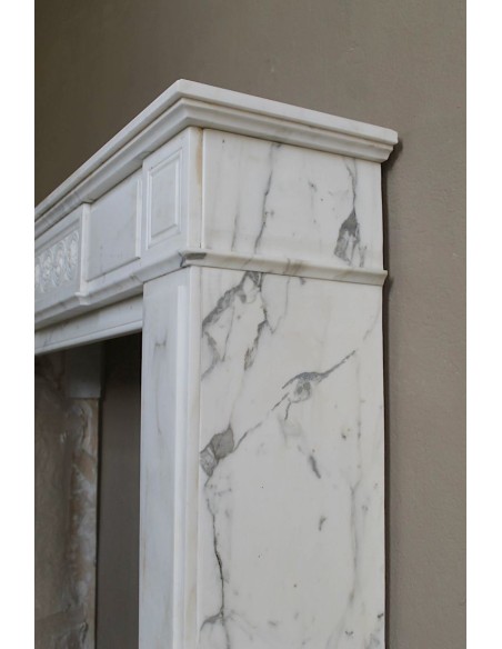 Antique neoclassical "Macaron" mantelpiece carved in Statuary Carrara marble, with exquisite architectural design.