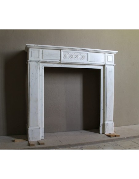 Antique neoclassical "Macaron" mantelpiece carved in Statuary Carrara marble, with exquisite architectural design.