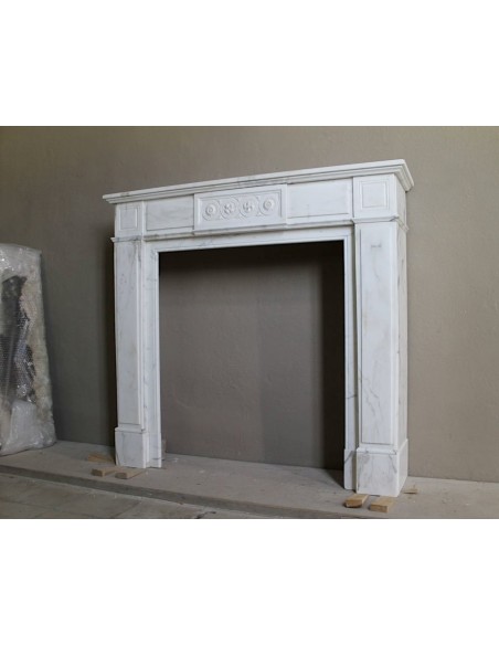 Antique neoclassical "Macaron" mantelpiece carved in Statuary Carrara marble, with exquisite architectural design.