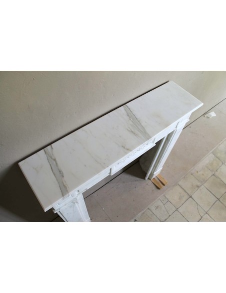 Antique neoclassical "Macaron" mantelpiece carved in Statuary Carrara marble, with exquisite architectural design.