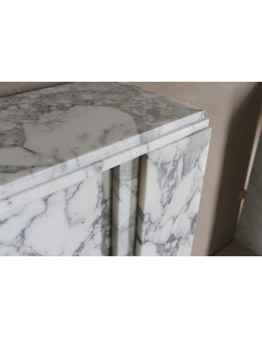 Antique iconic Art Deco mantelpiece carved in white veined Arabescato marble with Portoro marble inserts.