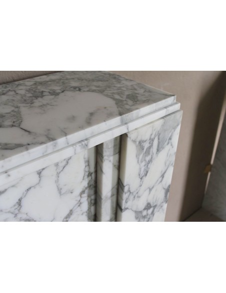 Antique iconic Art Deco mantelpiece carved in white veined Arabescato marble with Portoro marble inserts.