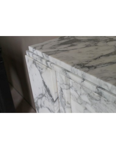 Antique iconic Art Deco mantelpiece carved in white veined Arabescato marble with Portoro marble inserts.