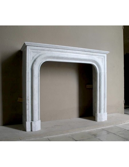 Antique white marble fireplace mantel called “Boudin Arrondi” because of its sinuous and refined lines.