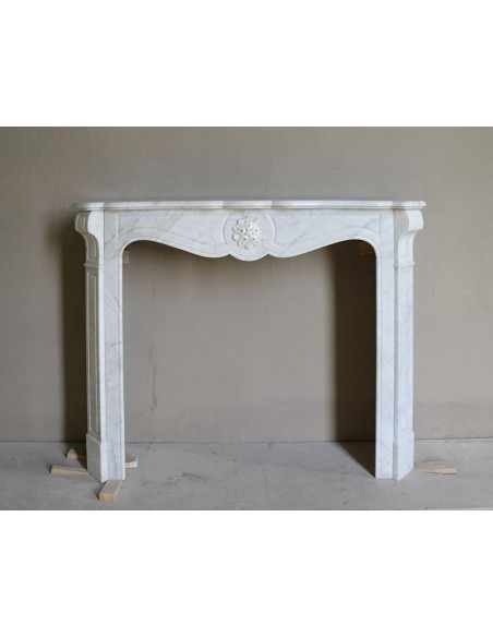 Antique “Pompadour” mantel in white Carrara marble at a discounted price, on sale. A beautiful mantelpiece at a very low price.