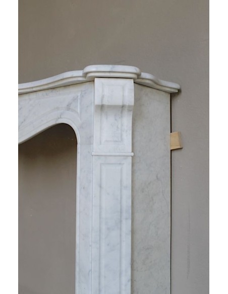 Antique “Pompadour” mantel in white Carrara marble at a discounted price, on sale. A beautiful mantelpiece at a very low price.