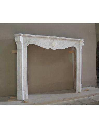 Antique “Pompadour” mantel in white Carrara marble at a discounted price, on sale. A beautiful mantelpiece at a very low price.