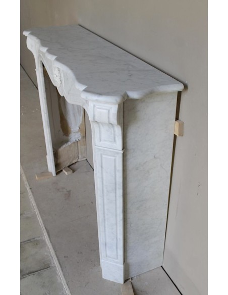Antique “Pompadour” mantel in white Carrara marble at a discounted price, on sale. A beautiful mantelpiece at a very low price.