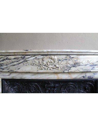 Neoclassical mantelpiece in veined Statuary marble with tones from white to beige to violet, with its original cast iron insert.