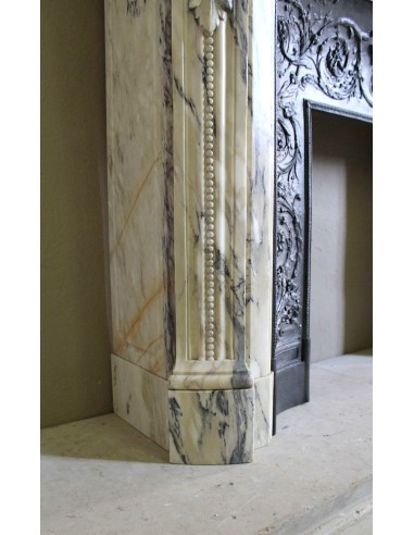 Neoclassical mantelpiece in veined Statuary marble with tones from white to beige to violet, with its original cast iron insert.