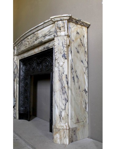 Neoclassical mantelpiece in veined Statuary marble with tones from white to beige to violet, with its original cast iron insert.
