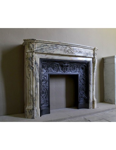 Neoclassical mantelpiece in veined Statuary marble with tones from white to beige to violet, with its original cast iron insert.