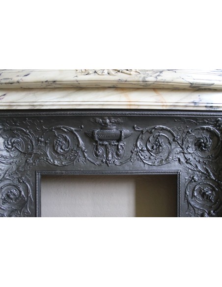 Neoclassical mantelpiece in veined Statuary marble with tones from white to beige to violet, with its original cast iron insert.