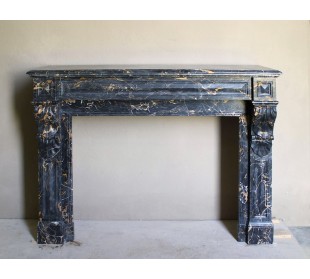 Genuine 19th century Portoro Gold marble fireplace mantel with diamond-pointed carvings.