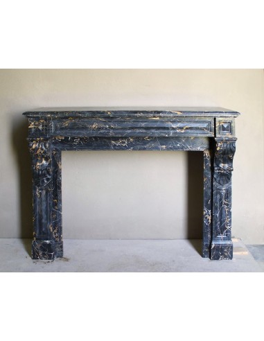 Genuine 19th century Portoro Gold marble fireplace mantel with diamond-pointed carvings.