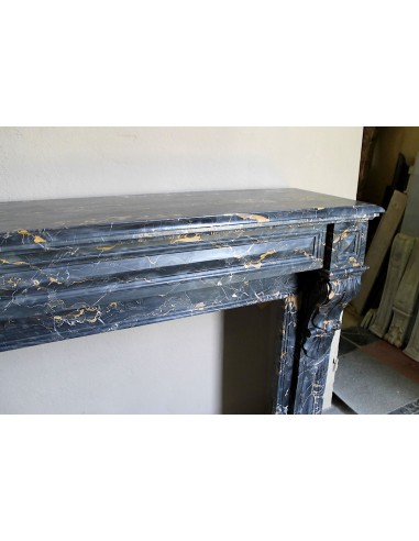 Genuine 19th century Portoro Gold marble fireplace mantel with diamond-pointed carvings.