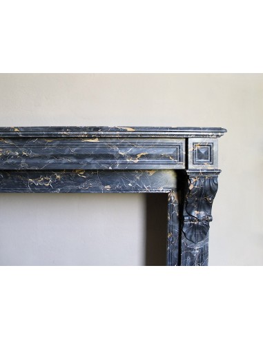 Genuine 19th century Portoro Gold marble fireplace mantel with diamond-pointed carvings.
