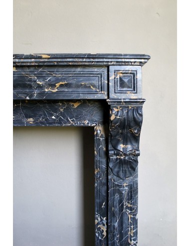 Genuine 19th century Portoro Gold marble fireplace mantel with diamond-pointed carvings.