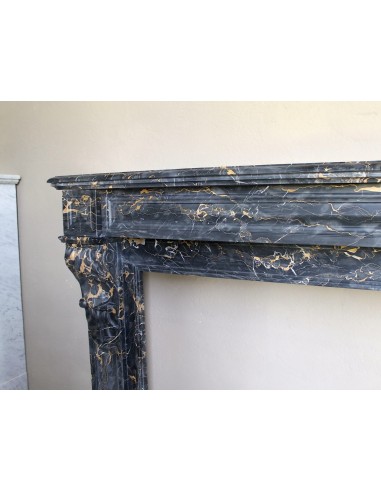 Genuine 19th century Portoro Gold marble fireplace mantel with diamond-pointed carvings.