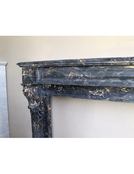 Genuine 19th century Portoro Gold marble fireplace mantel with diamond-pointed carvings.