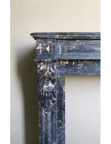 Genuine 19th century Portoro Gold marble fireplace mantel with diamond-pointed carvings.