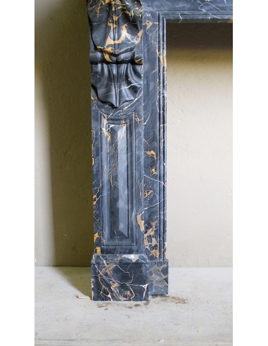Genuine 19th century Portoro Gold marble fireplace mantel with diamond-pointed carvings.