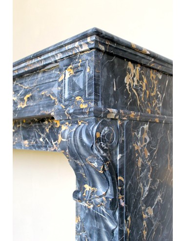 Genuine 19th century Portoro Gold marble fireplace mantel with diamond-pointed carvings.