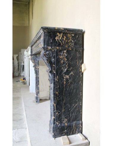 Genuine 19th century Portoro Gold marble fireplace mantel with diamond-pointed carvings.