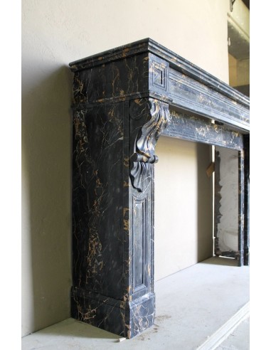Genuine 19th century Portoro Gold marble fireplace mantel with diamond-pointed carvings.