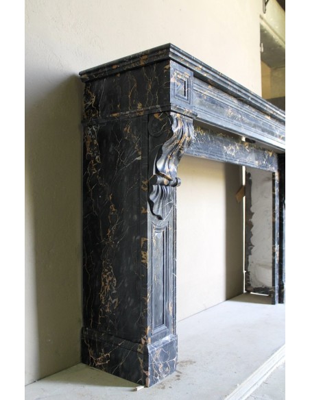 Genuine 19th century Portoro Gold marble fireplace mantel with diamond-pointed carvings.