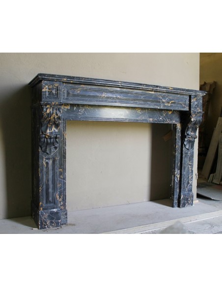 Genuine 19th century Portoro Gold marble fireplace mantel with diamond-pointed carvings.