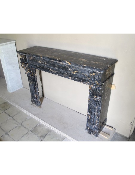 Genuine 19th century Portoro Gold marble fireplace mantel with diamond-pointed carvings.