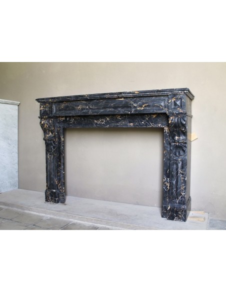 Genuine 19th century Portoro Gold marble fireplace mantel with diamond-pointed carvings.