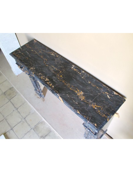 Genuine 19th century Portoro Gold marble fireplace mantel with diamond-pointed carvings.