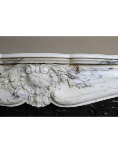 Antique Louis XV “Trois Glands” fireplace mantel in  White veined Calacatta marble provided with cast iron insert.