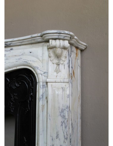 Antique Louis XV “Trois Glands” fireplace mantel in  White veined Calacatta marble provided with cast iron insert.