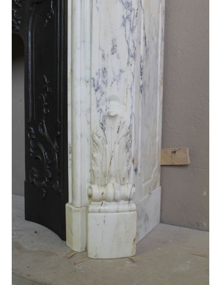 Antique Louis XV “Trois Glands” fireplace mantel in  White veined Calacatta marble provided with cast iron insert.