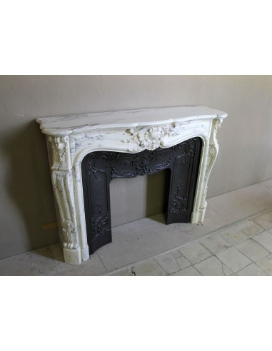 Antique Louis XV “Trois Glands” fireplace mantel in  White veined Calacatta marble provided with cast iron insert.