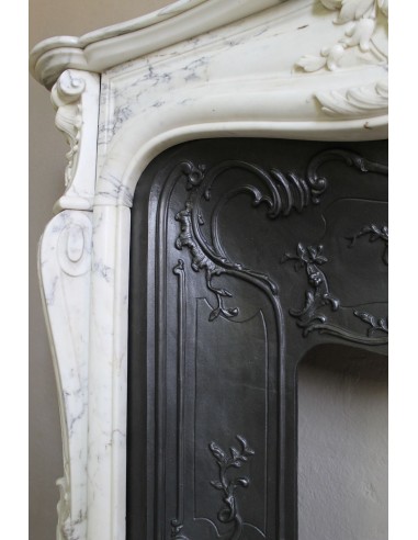 Antique Louis XV “Trois Glands” fireplace mantel in  White veined Calacatta marble provided with cast iron insert.