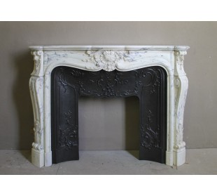 Antique Louis XV “Trois Glands” fireplace mantel in  White veined Calacatta marble provided with cast iron insert.