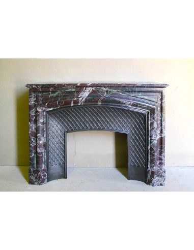 Antique “Boudin” mantelpiece in Levanto marble in red, green, violet, and white. This fireplace mantel has its cast iron insert.