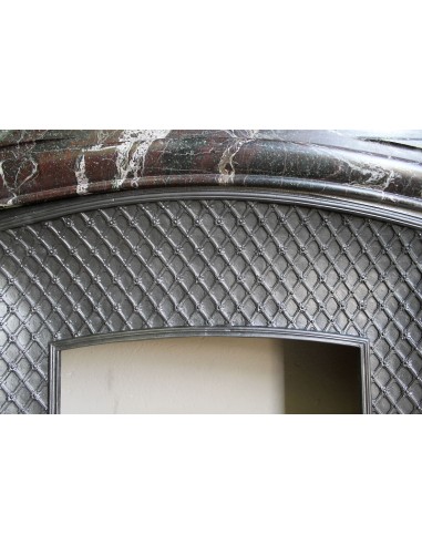 Antique “Boudin” mantelpiece in Levanto marble in red, green, violet, and white. This fireplace mantel has its cast iron insert.